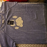 I laid out the sweatshirt so the cut and design could sort of be made out. I like this relaxed sweatshirt, the Paw Print and I really like the color. I have since worn this out and removed the label. Giving one to my sister too.
