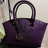 I love this purse! <3. Ever since I got my cat I have been obsessed with their Paw Print merchandise.